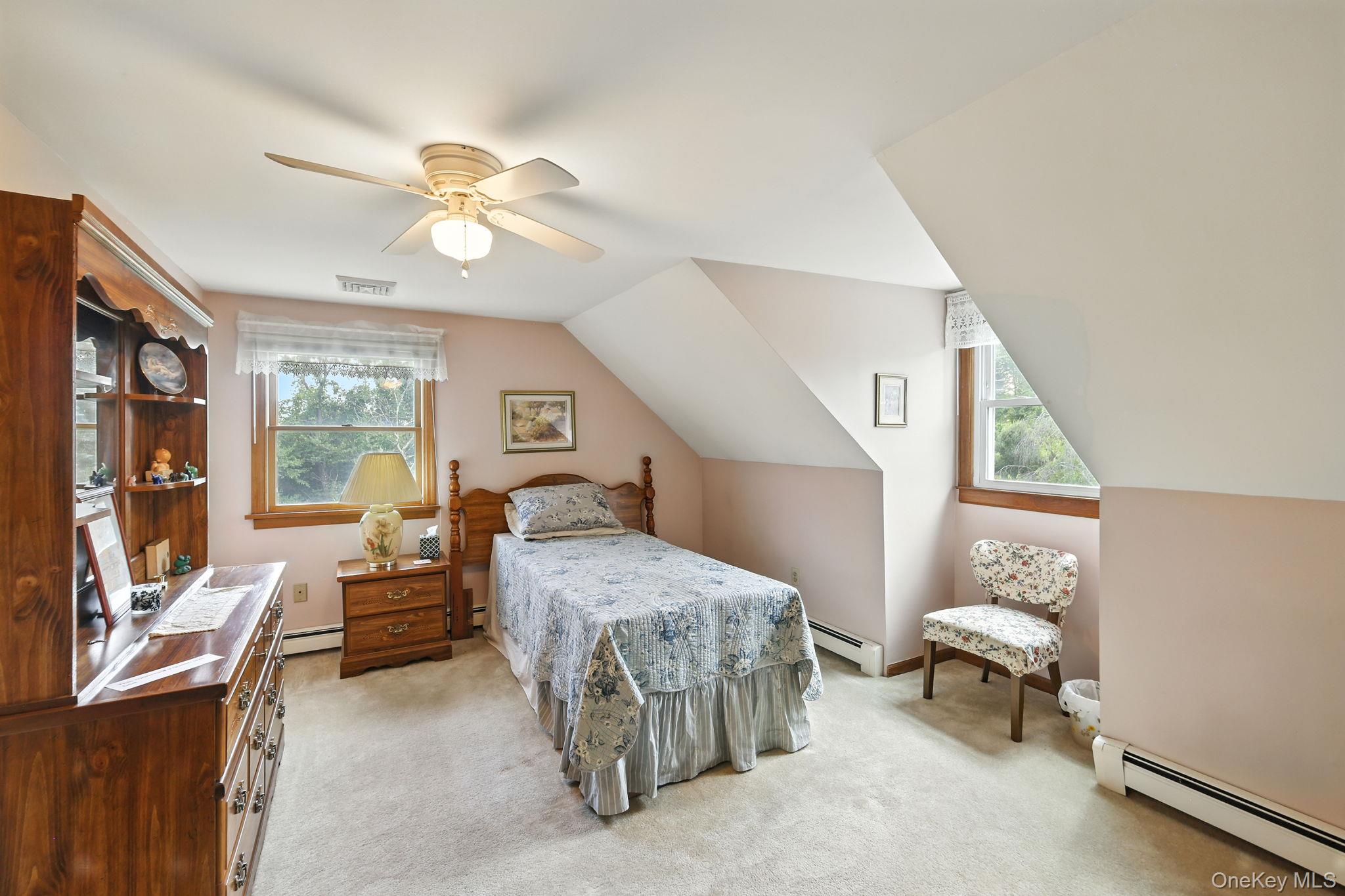 220 North Parliman Road LaGrangeville, NY 12540 - Photo 22 of 41 a bedroom with a bed and a chandelier