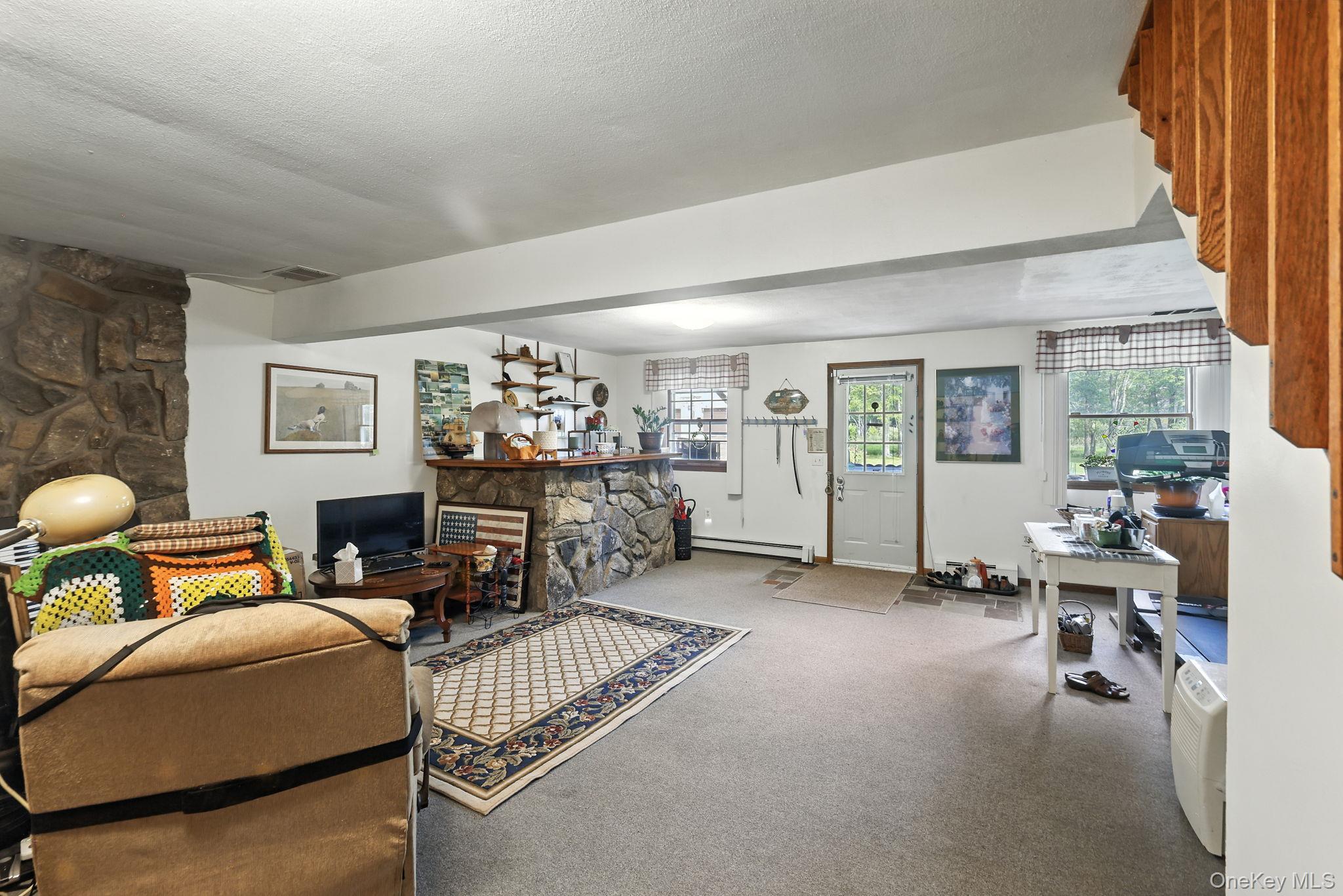 220 North Parliman Road LaGrangeville, NY 12540 - Photo 23 of 41 a living room with furniture and a lamp