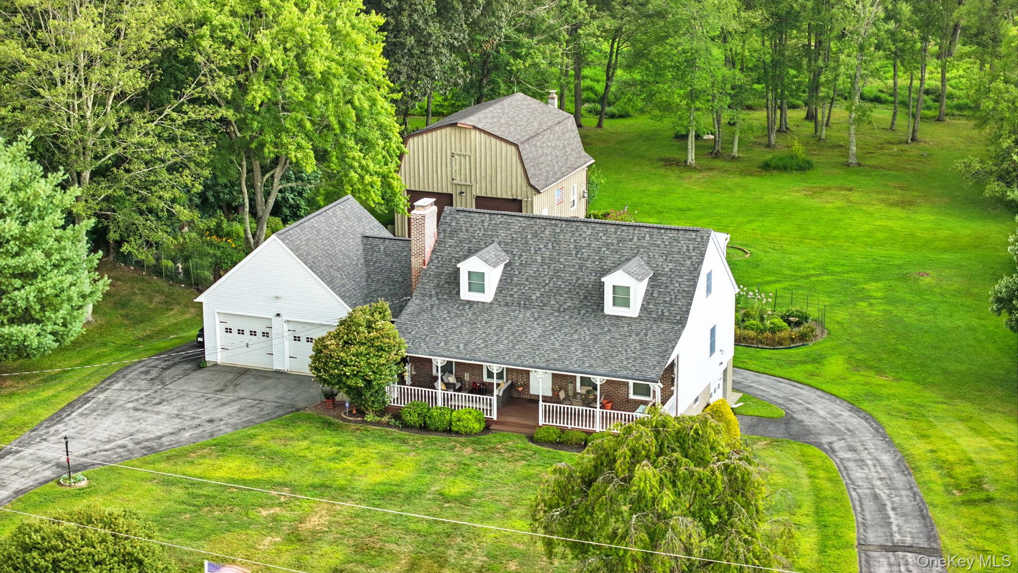 220 North Parliman Road LaGrangeville, NY 12540 - Photo 32 of 41 an aerial view of a house with swimming pool garden and patio