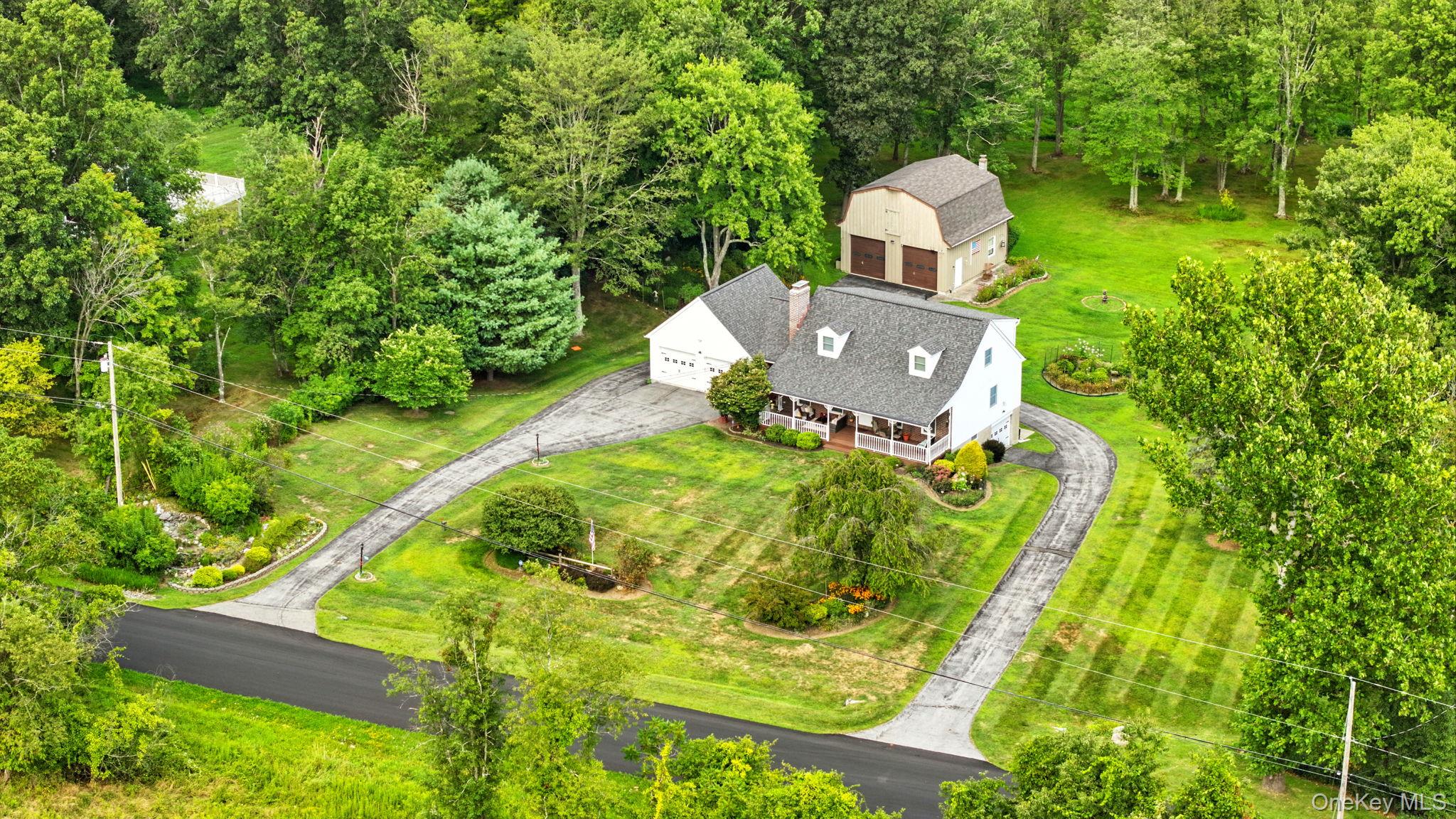 220 North Parliman Road LaGrangeville, NY 12540 - Photo 33 of 41 a aerial view of a house with pool and garden