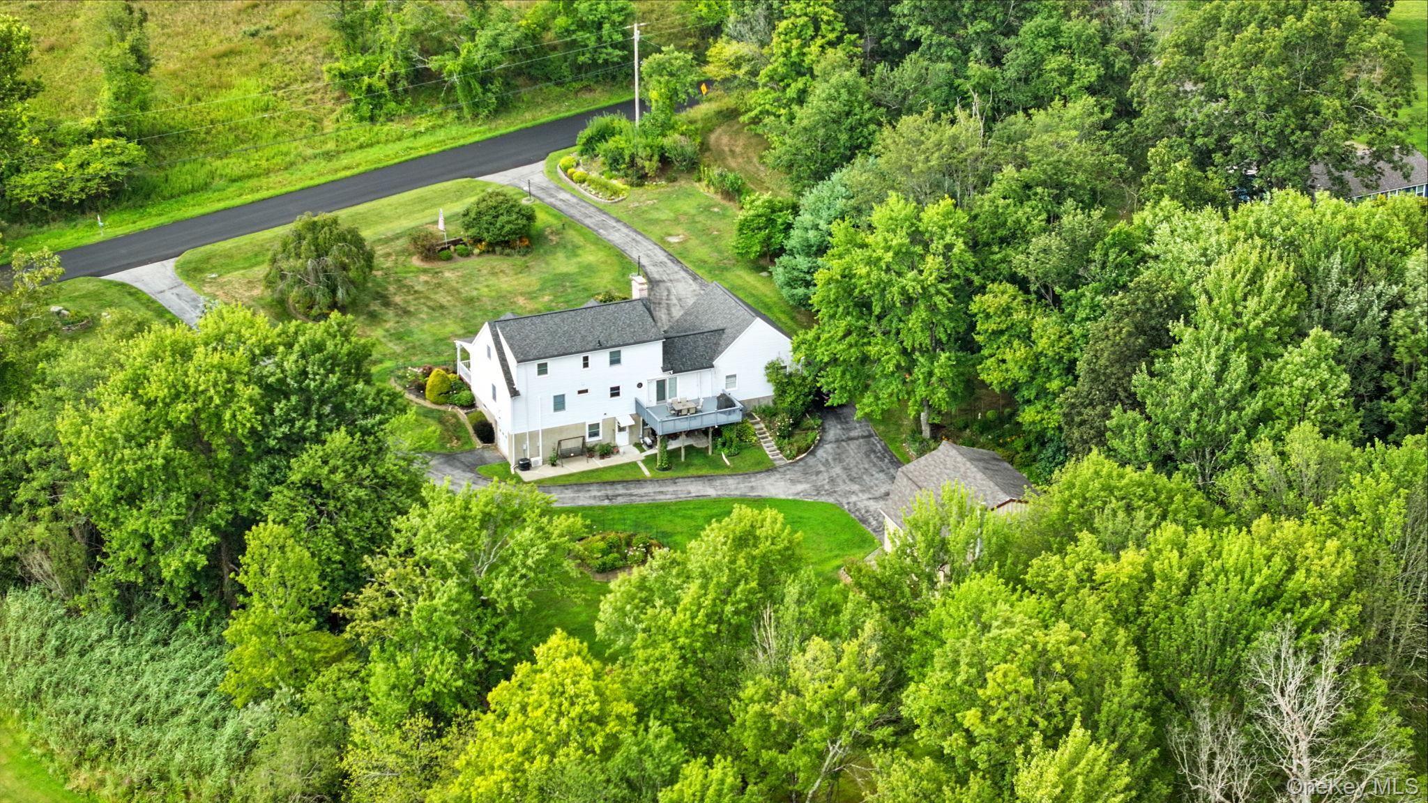 220 North Parliman Road LaGrangeville, NY 12540 - Photo 36 of 41 a view of a house with a yard and a fountain