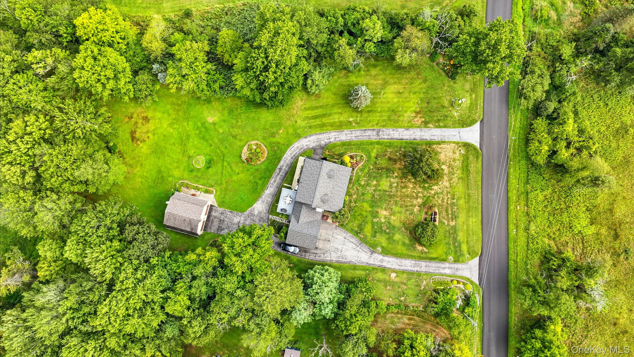 220 North Parliman Road LaGrangeville, NY 12540 - Photo 38 of 41 a view of a garden from a bench