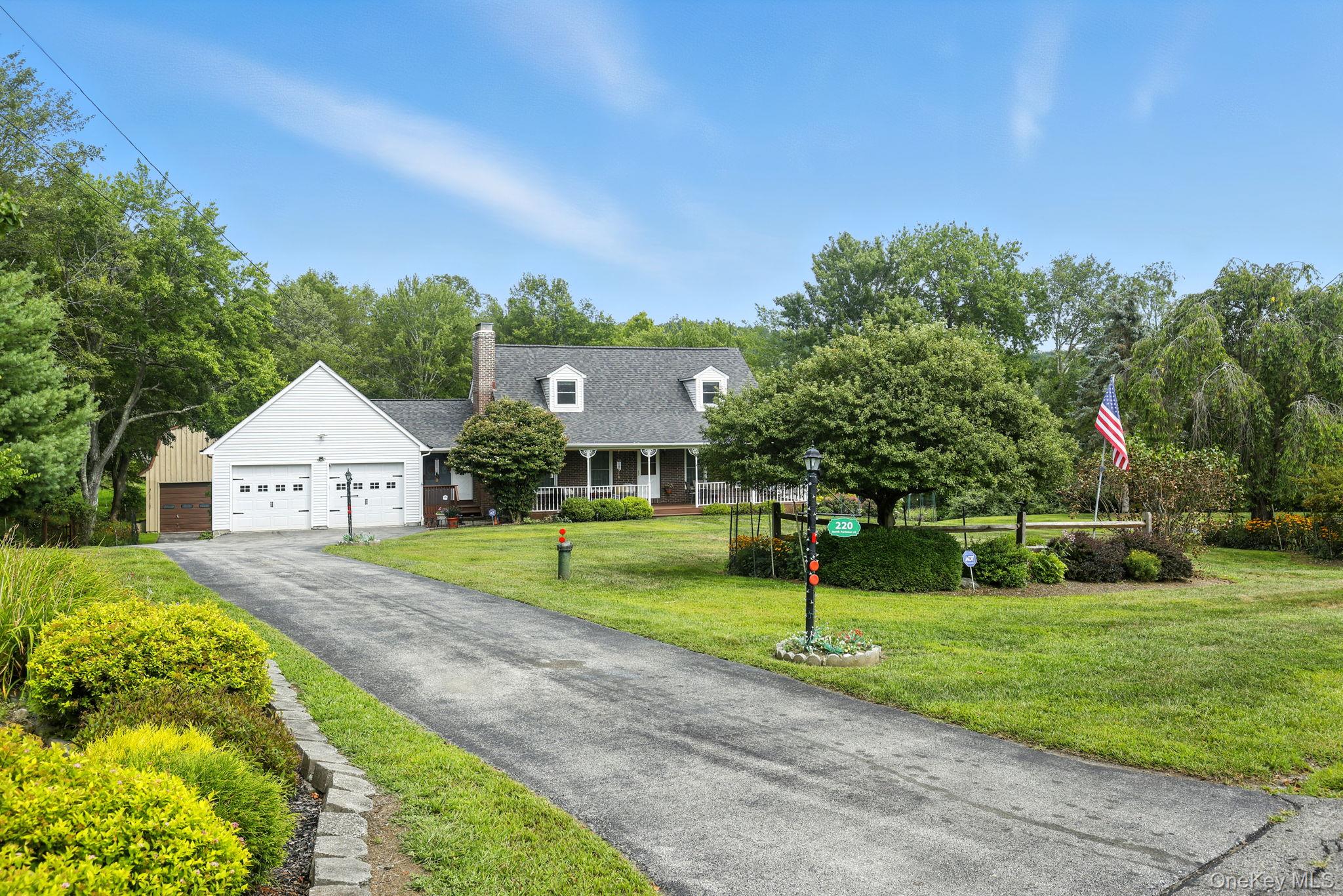 220 North Parliman Road LaGrangeville, NY 12540 - Photo 4 of 41 a view of an house with a big yard and large trees