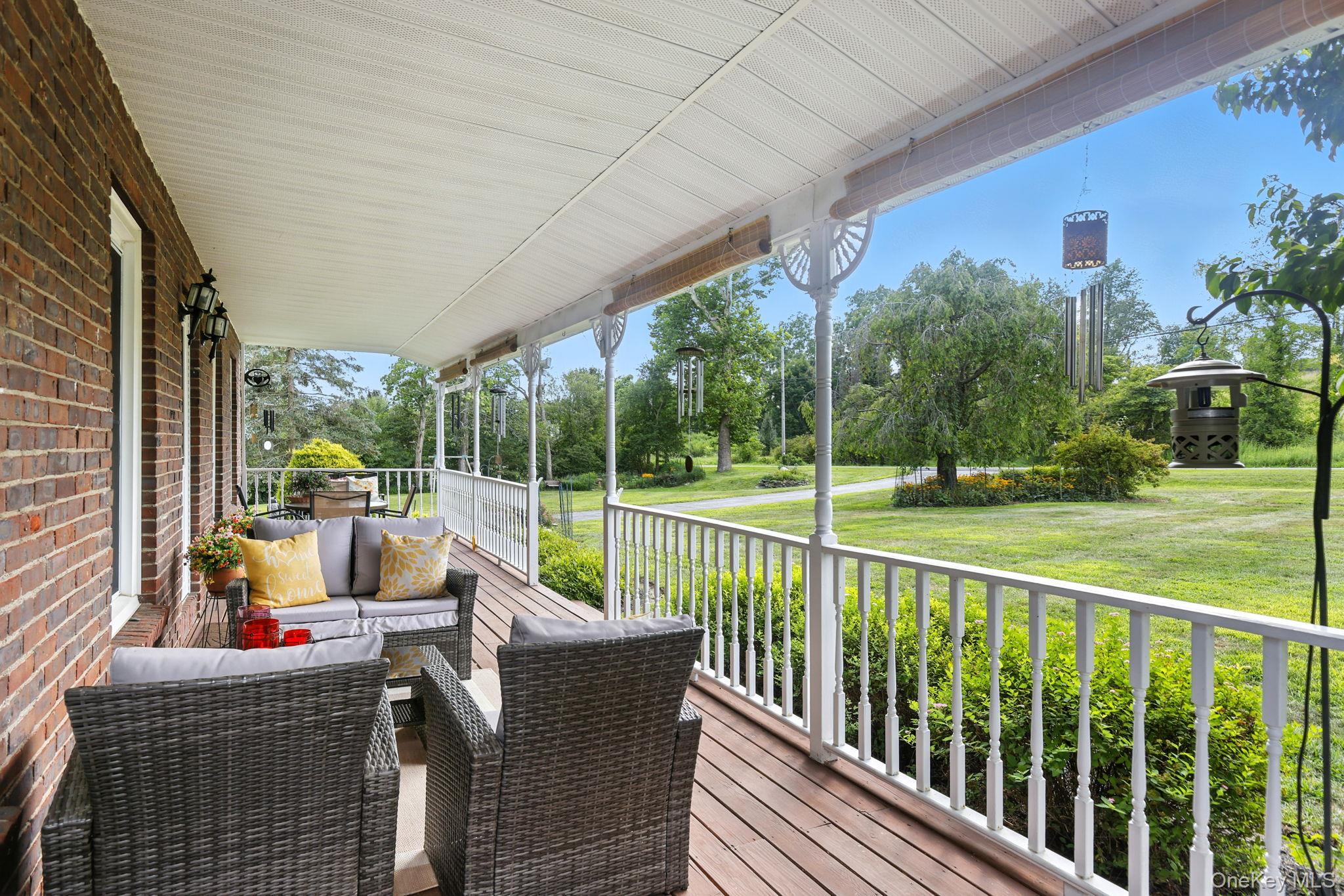 220 North Parliman Road LaGrangeville, NY 12540 - Photo 7 of 41 a view of roof deck with chairs and floor to ceiling window next to a yard