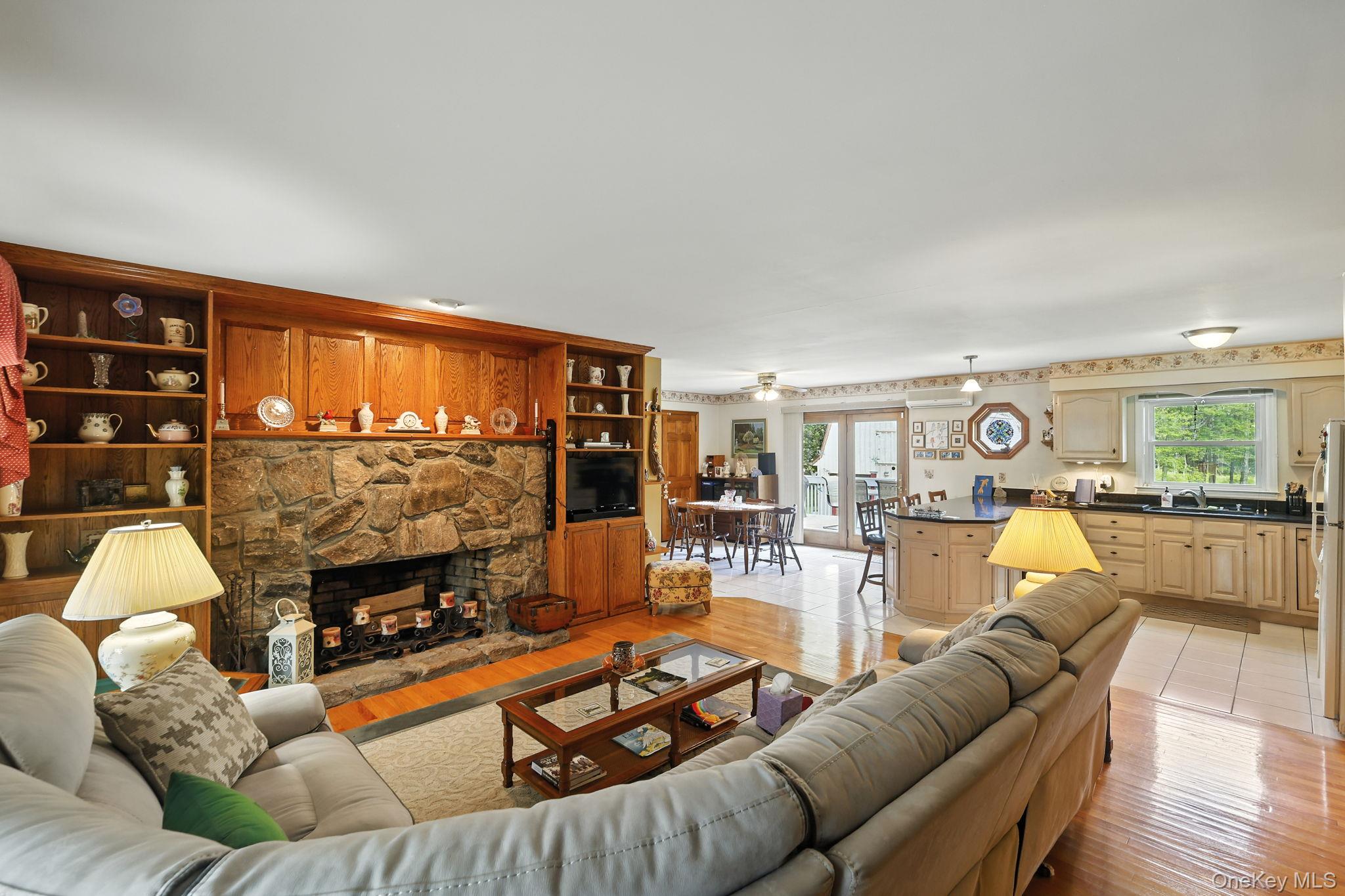 220 North Parliman Road LaGrangeville, NY 12540 - Photo 8 of 41 a living room with furniture and a fireplace