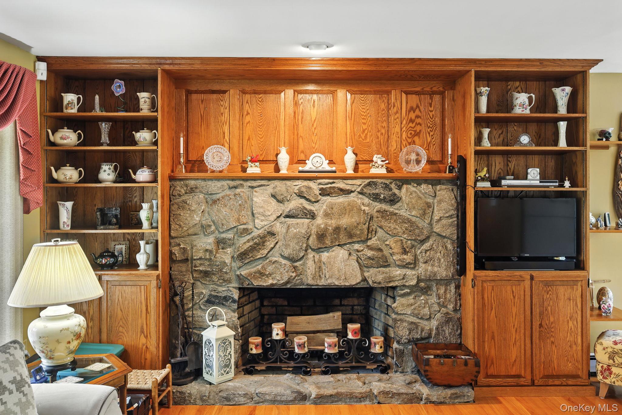 220 North Parliman Road LaGrangeville, NY 12540 - Photo 9 of 41 a living room with fireplace furniture and a flat screen tv