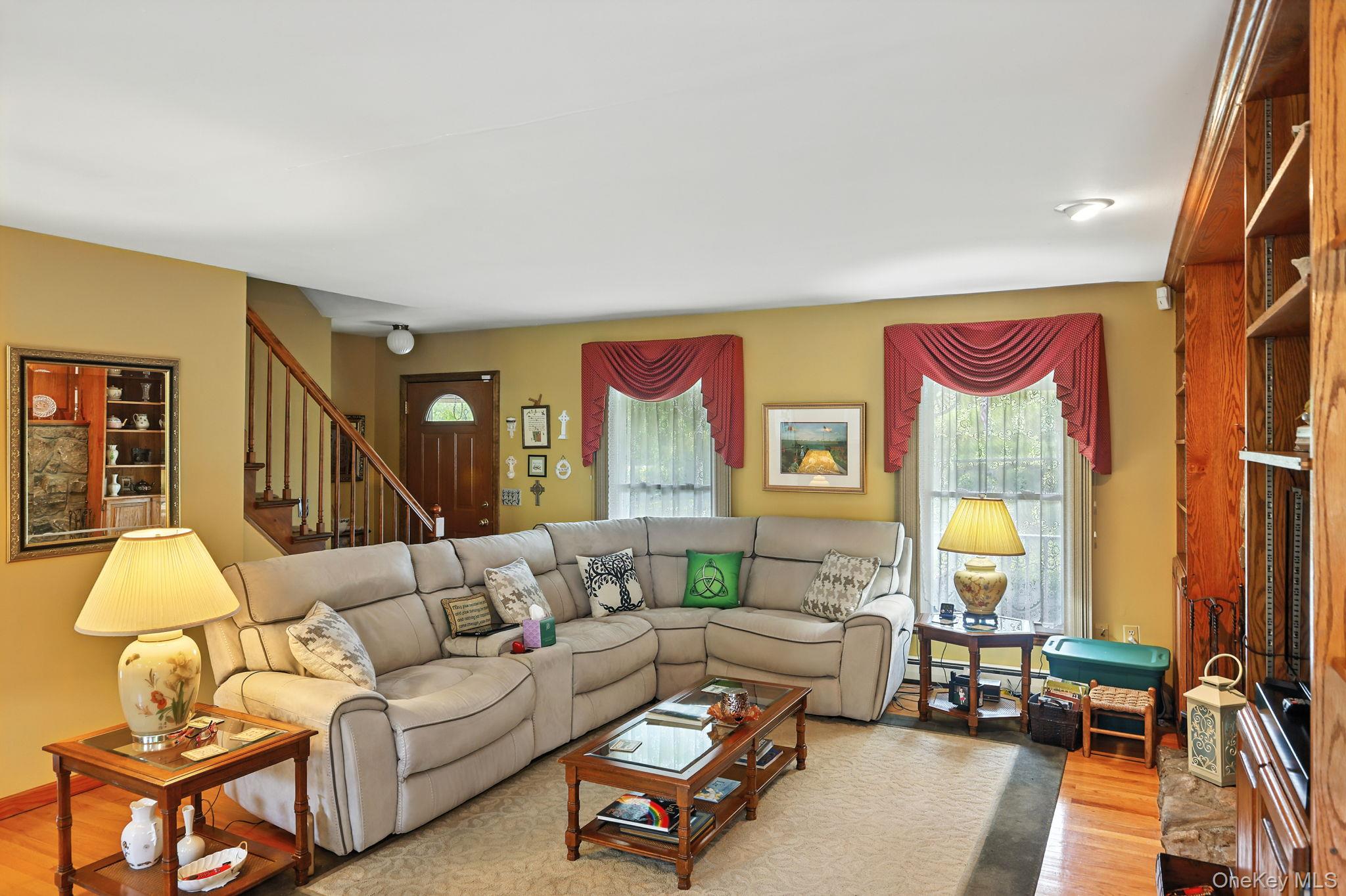 220 North Parliman Road LaGrangeville, NY 12540 - Photo 10 of 41 a living room with furniture and a lamp