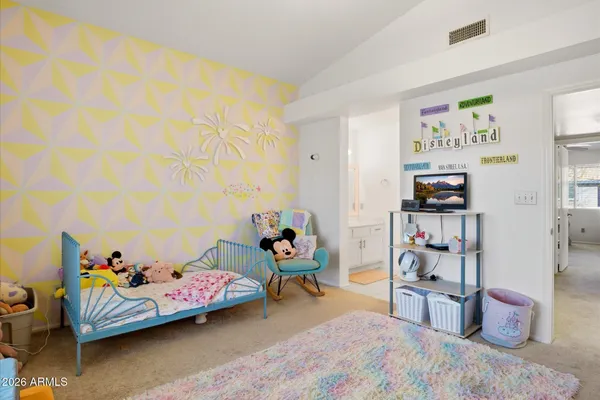 a bedroom with furniture and a bed