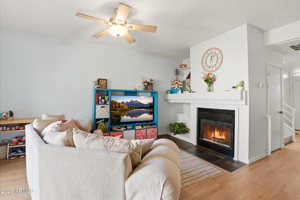 a living room with furniture and a fireplace