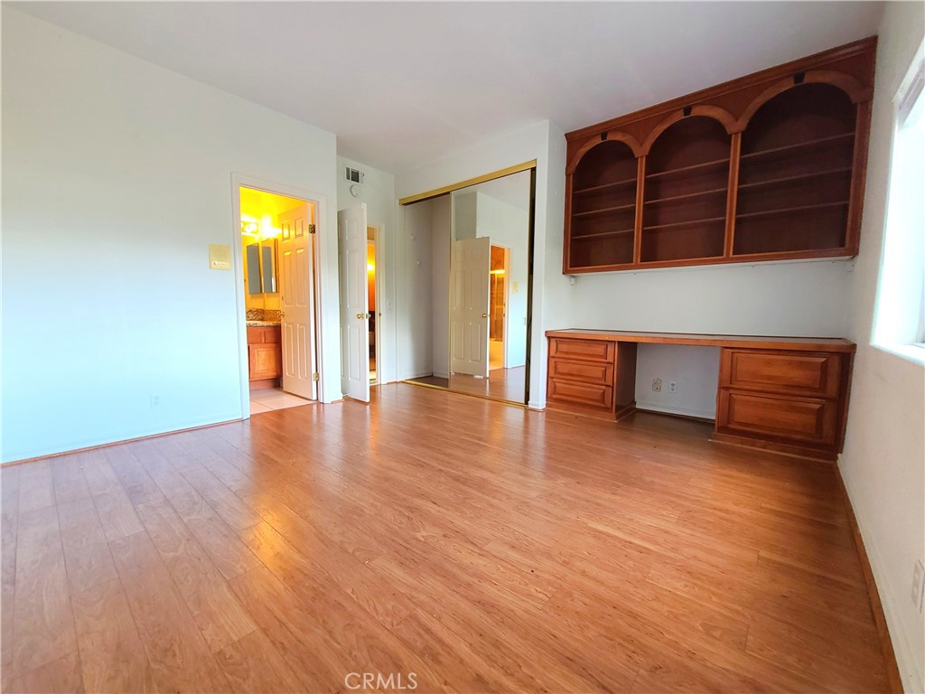 306 Edgemont Drive Redlands, CA 92373 - Photo 12 of 24 a view of an empty room with wooden floor and a window