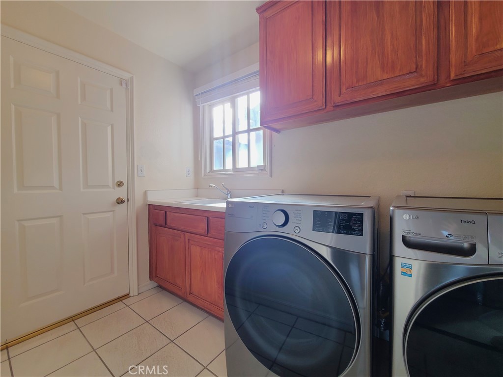 306 Edgemont Drive Redlands, CA 92373 - Photo 15 of 24 a storage room with washer and dryer