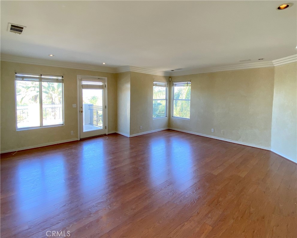 306 Edgemont Drive Redlands, CA 92373 - Photo 16 of 24 a view of an empty room with wooden floor and a window