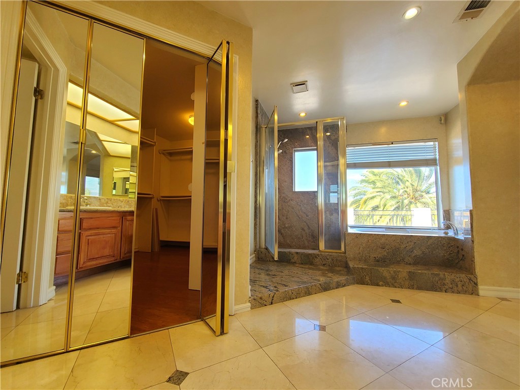 306 Edgemont Drive Redlands, CA 92373 - Photo 18 of 24 a bathroom with a tub shower and sink