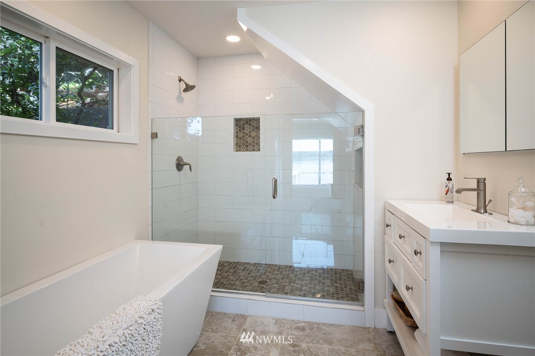 13133 Burma Road Southwest Vashon, WA 98070 - Photo 22 of 40 a bathroom with a tub sink and a mirror