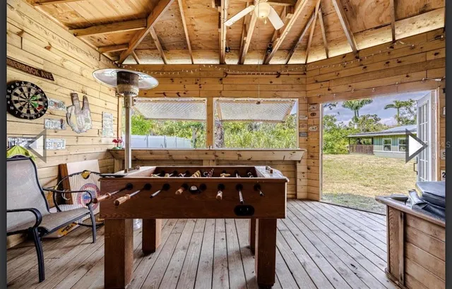 a view of a chairs and table in the patio
