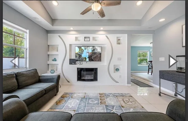 a living room with furniture and a fireplace