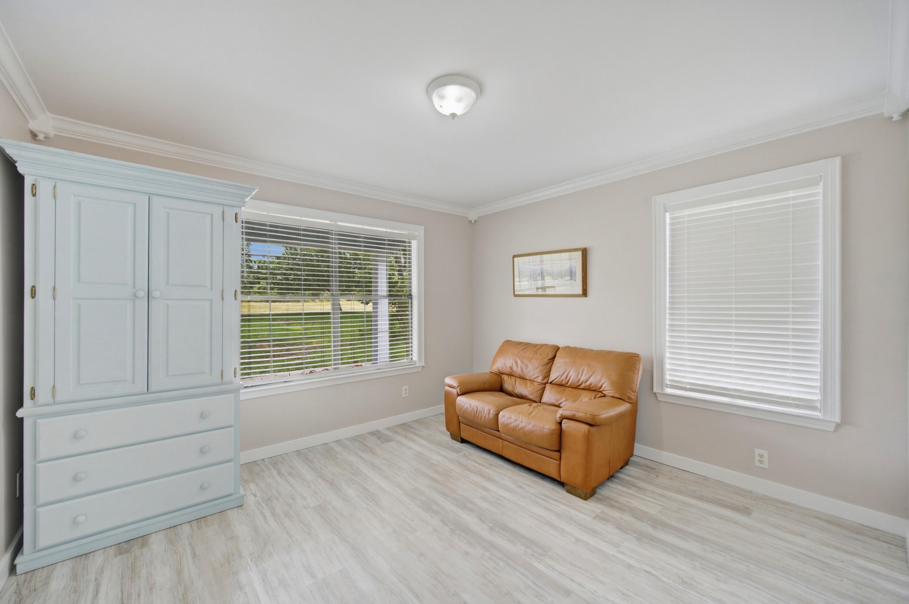 261 Wilkerson Road DeFuniak Springs, FL 32433 - Photo 48 of 76 a living room with furniture and a window