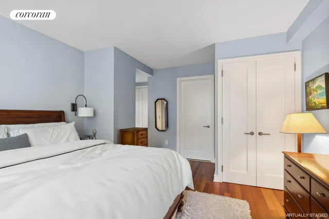 a bedroom with a bed and a dresser