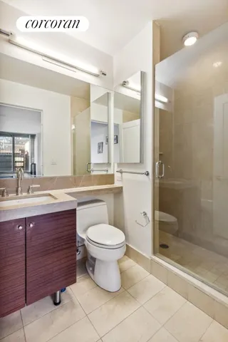 a bedroom with a bed and a lamp