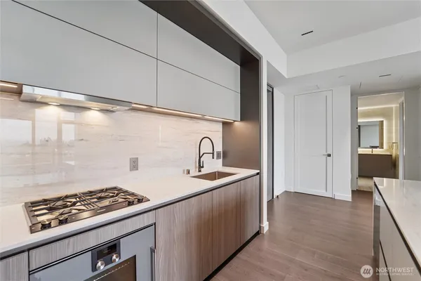 a kitchen with sink and stove