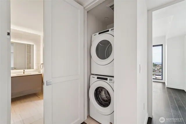 a view of a hallway with washer and dryer