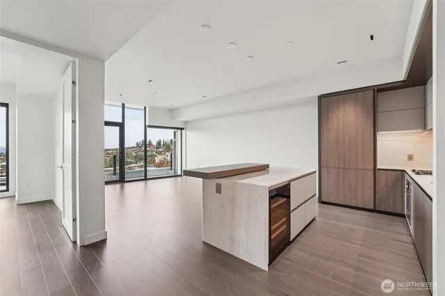 a kitchen with stainless steel appliances a stove top oven and a refrigerator
