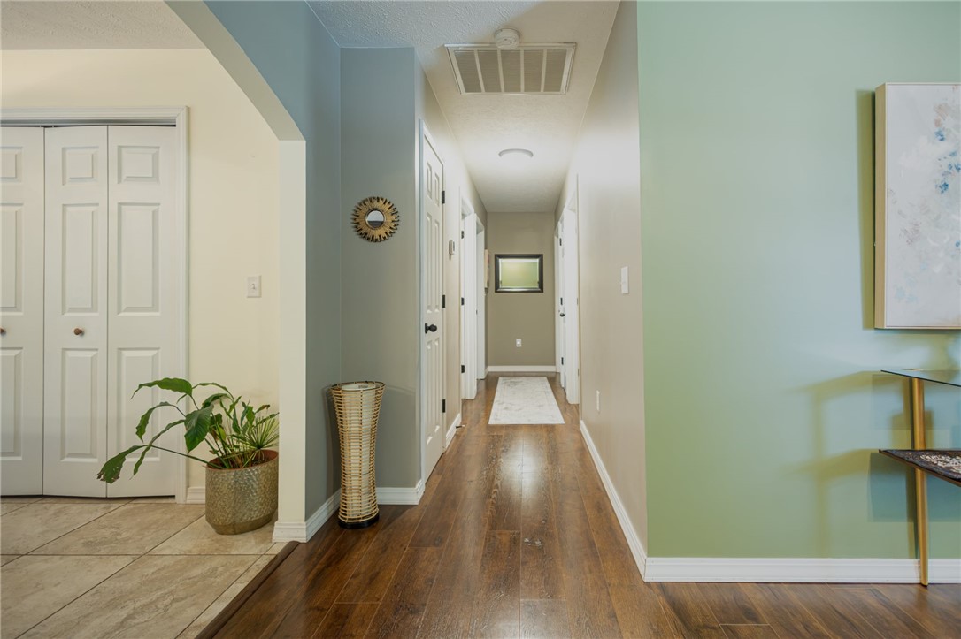 437 Gip Annie Road West Harrison, AR 72601 - Photo 11 of 21 Wood-finish flooring throughout the hallway