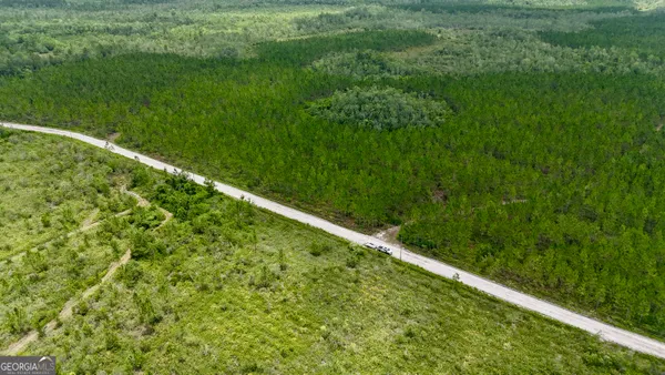 a yard with green field