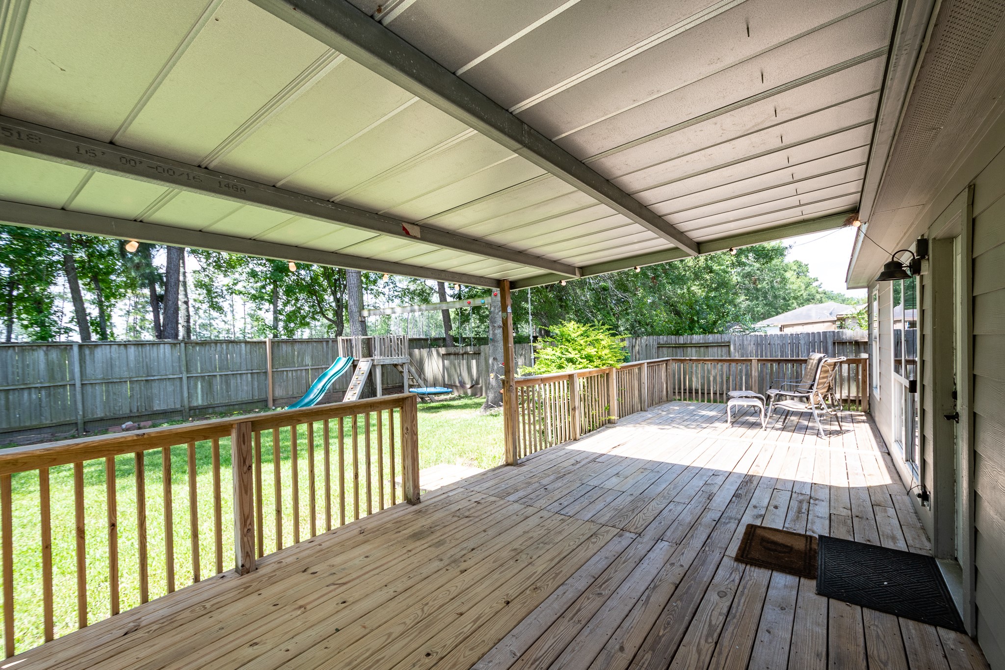 16392 Many Trees Lane Conroe, TX 77302 - Photo 27 of 33 Whether you like shade or want to lay in the sun, this deck offers it all