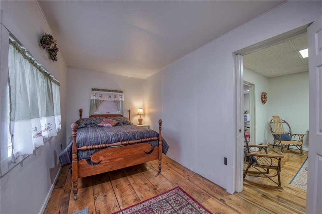 251 Town Road Dayton, PA 16222 - Photo 17 of 44 a bedroom with a bed and wooden floor