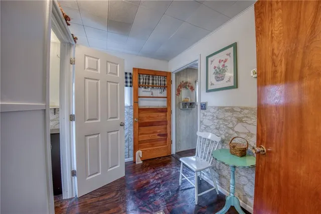 a view of entryway with wooden floor