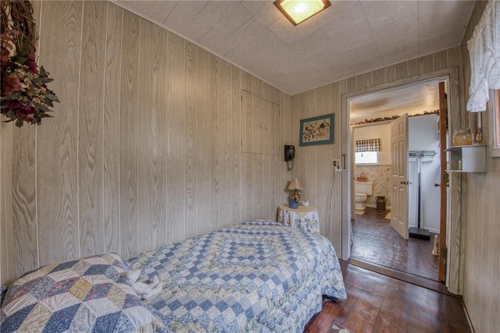 251 Town Road Dayton, PA 16222 - Photo 24 of 44 a bedroom with a bed and a chandelier