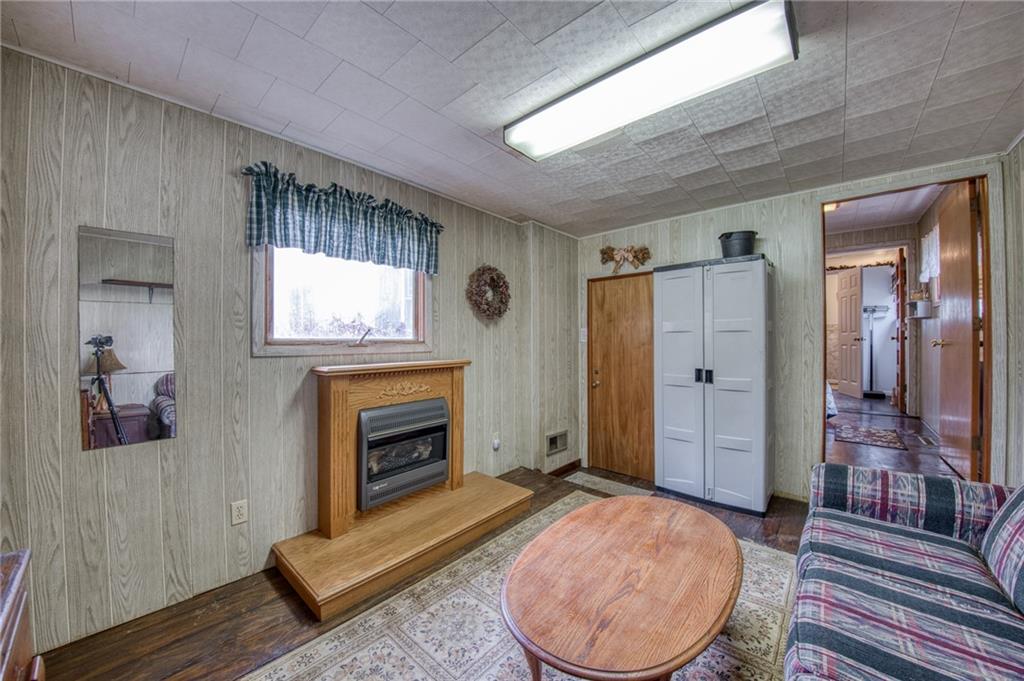 251 Town Road Dayton, PA 16222 - Photo 26 of 44 a living room with furniture a fireplace and a flat screen tv