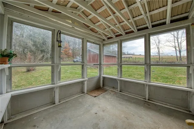 a view of an empty room with a large window