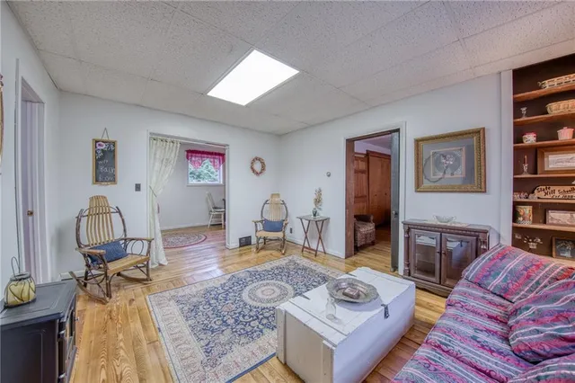 a living room with furniture and a table