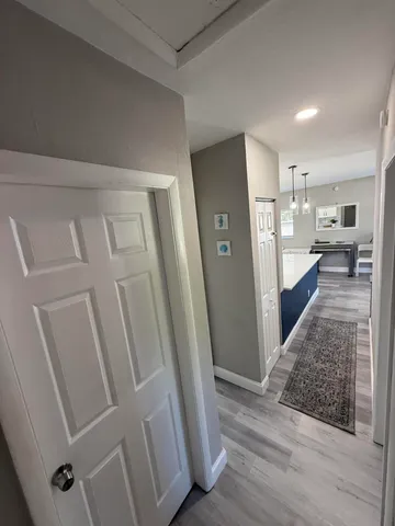a view of a kitchen from the hallway
