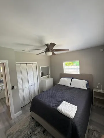 a bedroom with a bed and a table in it