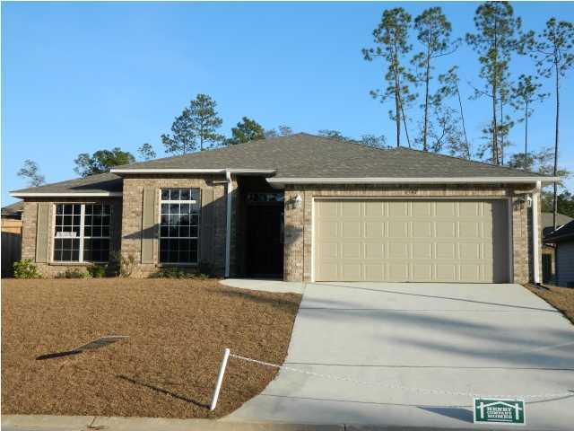 4506 Hermosa Road Crestview, FL 32539 - Photo 2 of 2 a front view of a house with a garden