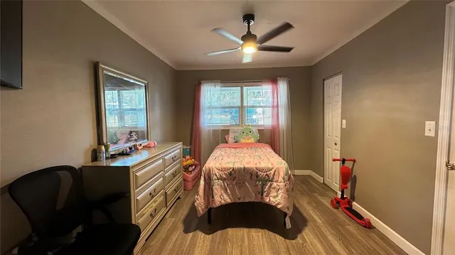 a bed room with a bed and a chandelier