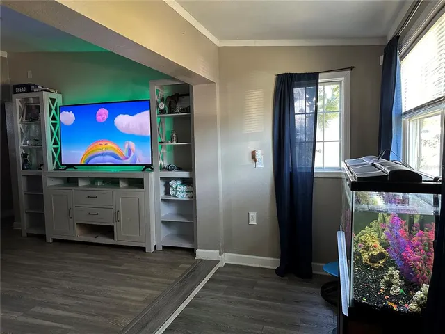 a room with furniture and wooden floor