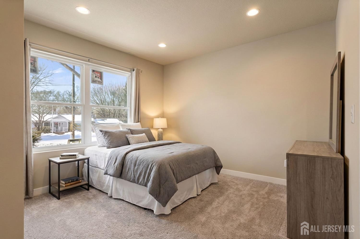 290 Fresh Ponds Road North Brunswick, NJ 08902 - Photo 12 of 44 a spacious bedroom with a bed and large windows