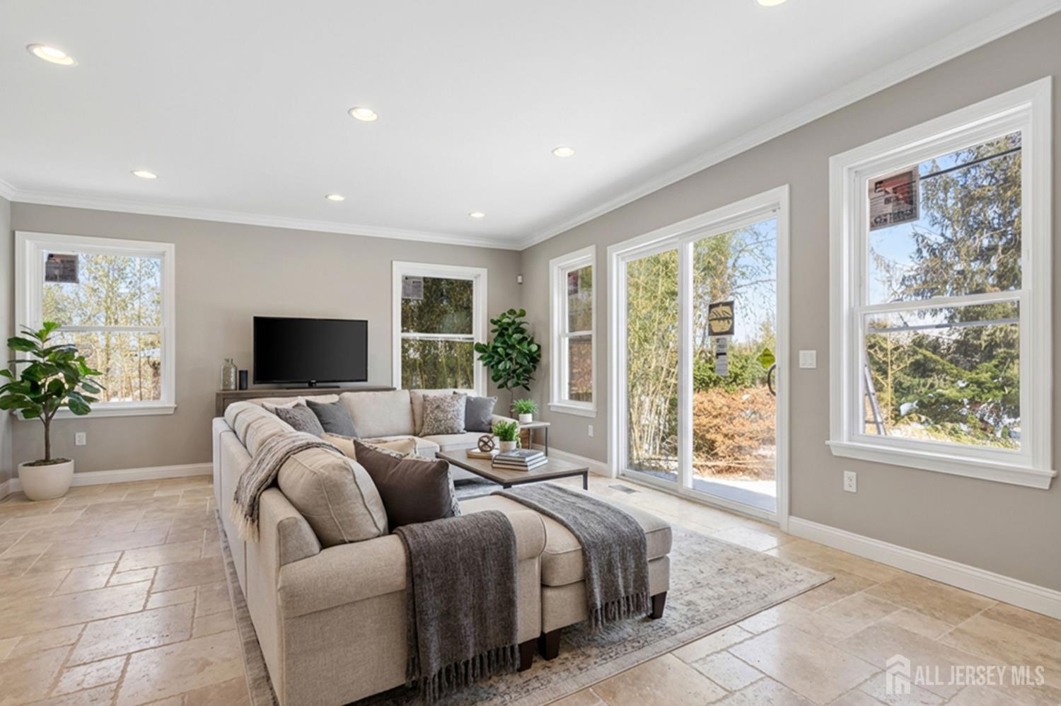 290 Fresh Ponds Road North Brunswick, NJ 08902 - Photo 14 of 44 a living room with furniture a flat screen tv and a large window