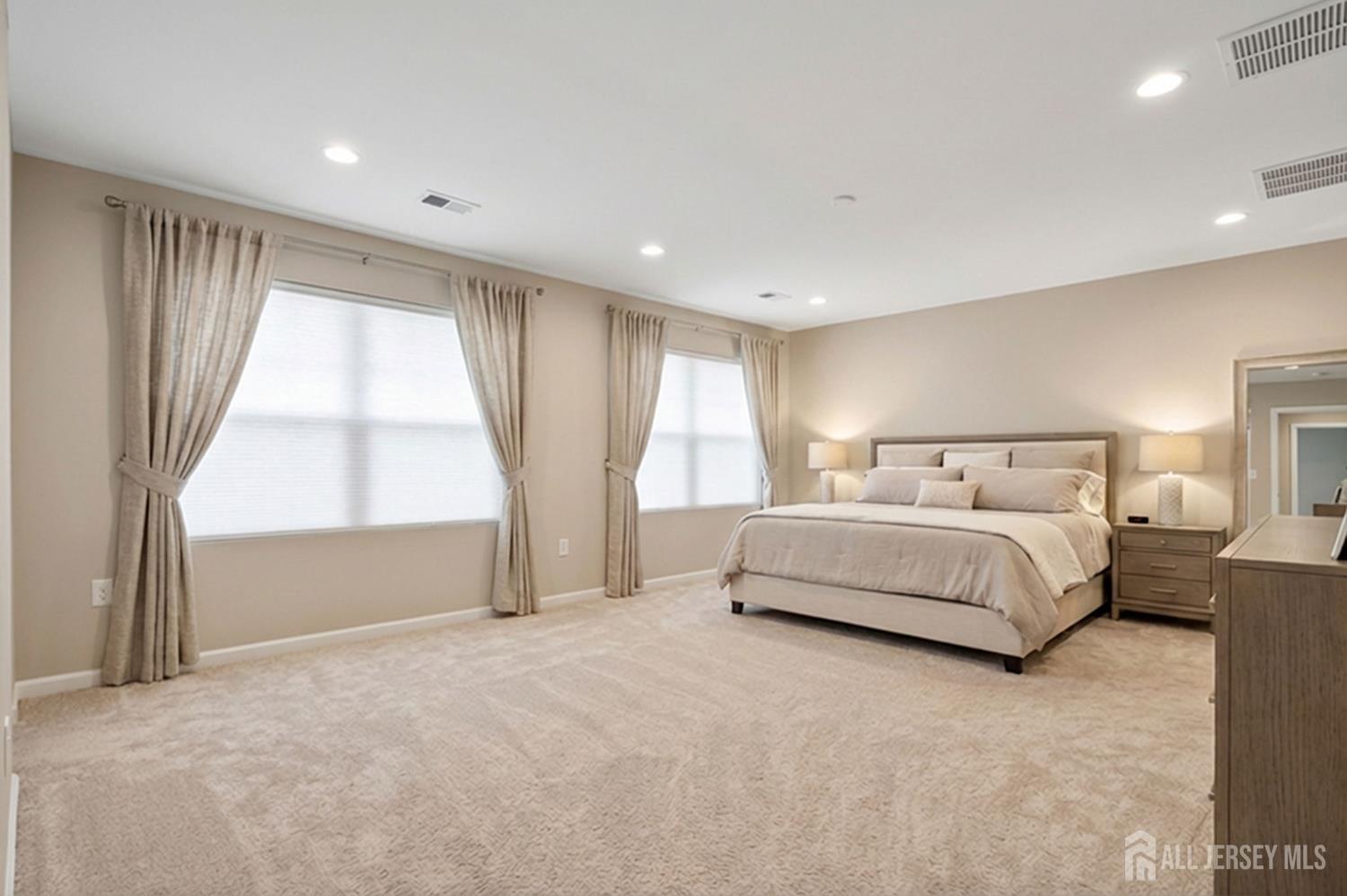 290 Fresh Ponds Road North Brunswick, NJ 08902 - Photo 21 of 44 a spacious bedroom with a bed and a large window