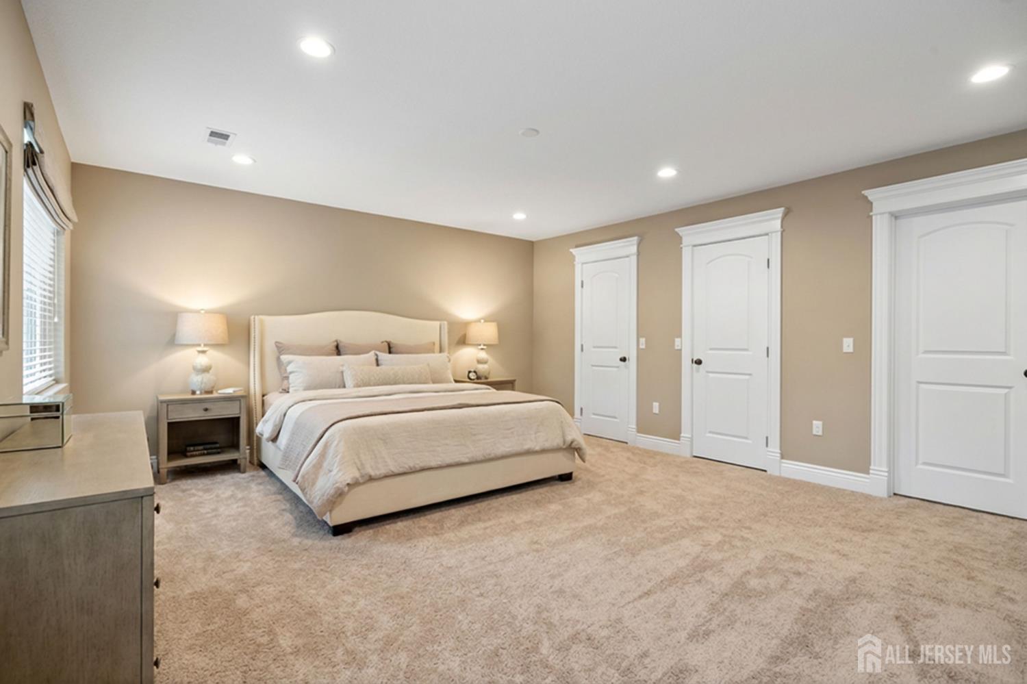 290 Fresh Ponds Road North Brunswick, NJ 08902 - Photo 23 of 44 a spacious bedroom with a bed and a lamp