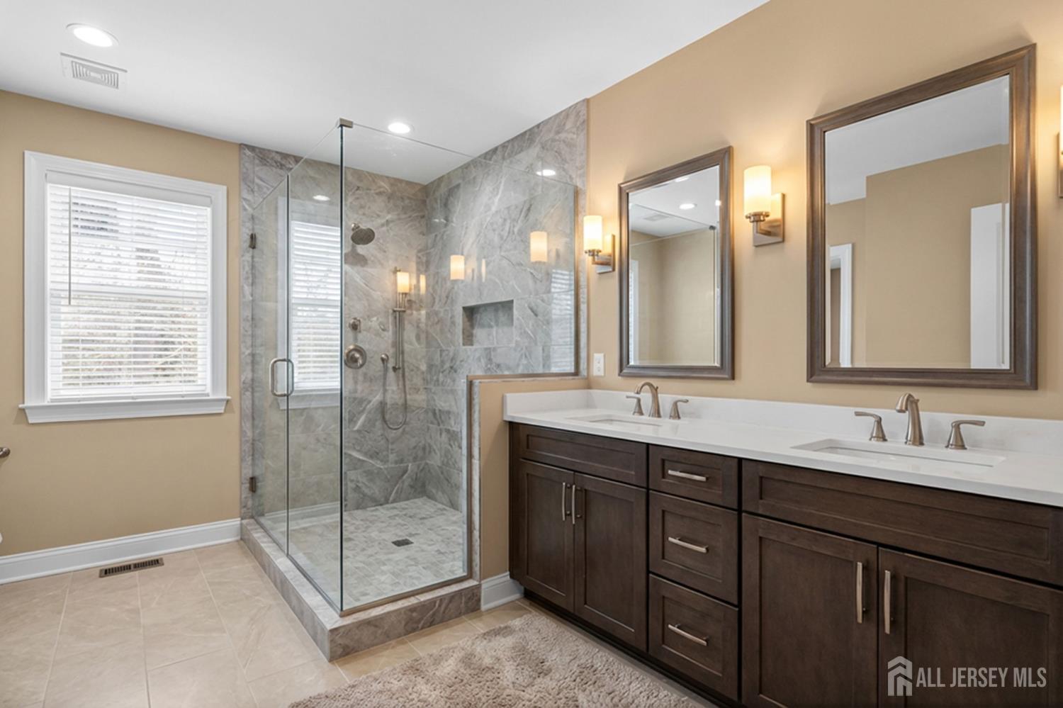 290 Fresh Ponds Road North Brunswick, NJ 08902 - Photo 25 of 44 a bathroom with double vanity sinks and a mirror