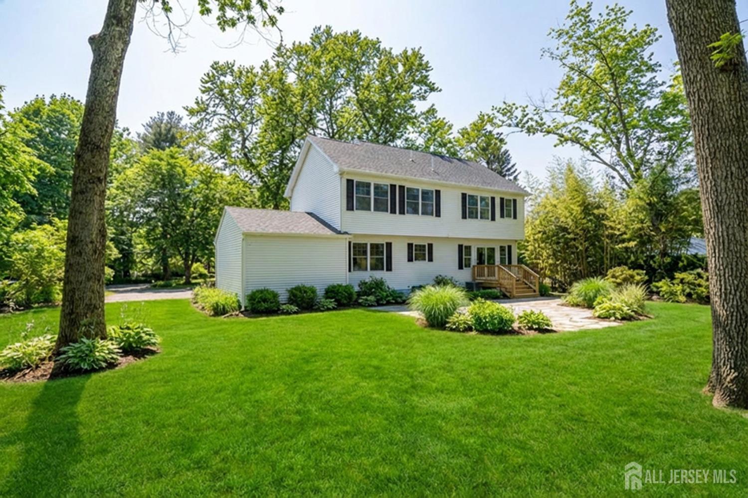 290 Fresh Ponds Road North Brunswick, NJ 08902 - Photo 38 of 44 a front view of a house with a yard and trees
