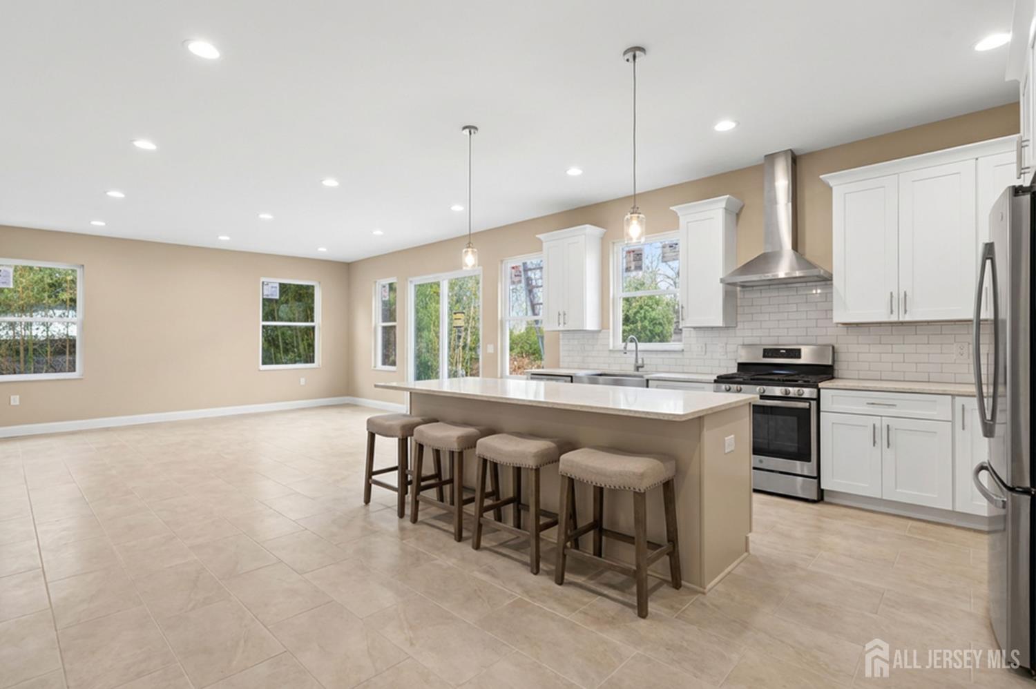 290 Fresh Ponds Road North Brunswick, NJ 08902 - Photo 9 of 44 a kitchen with stainless steel appliances granite countertop a stove and a sink