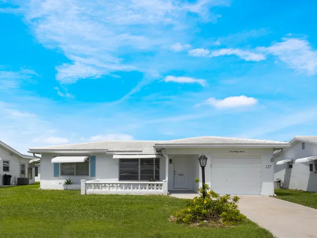a front view of house with yard