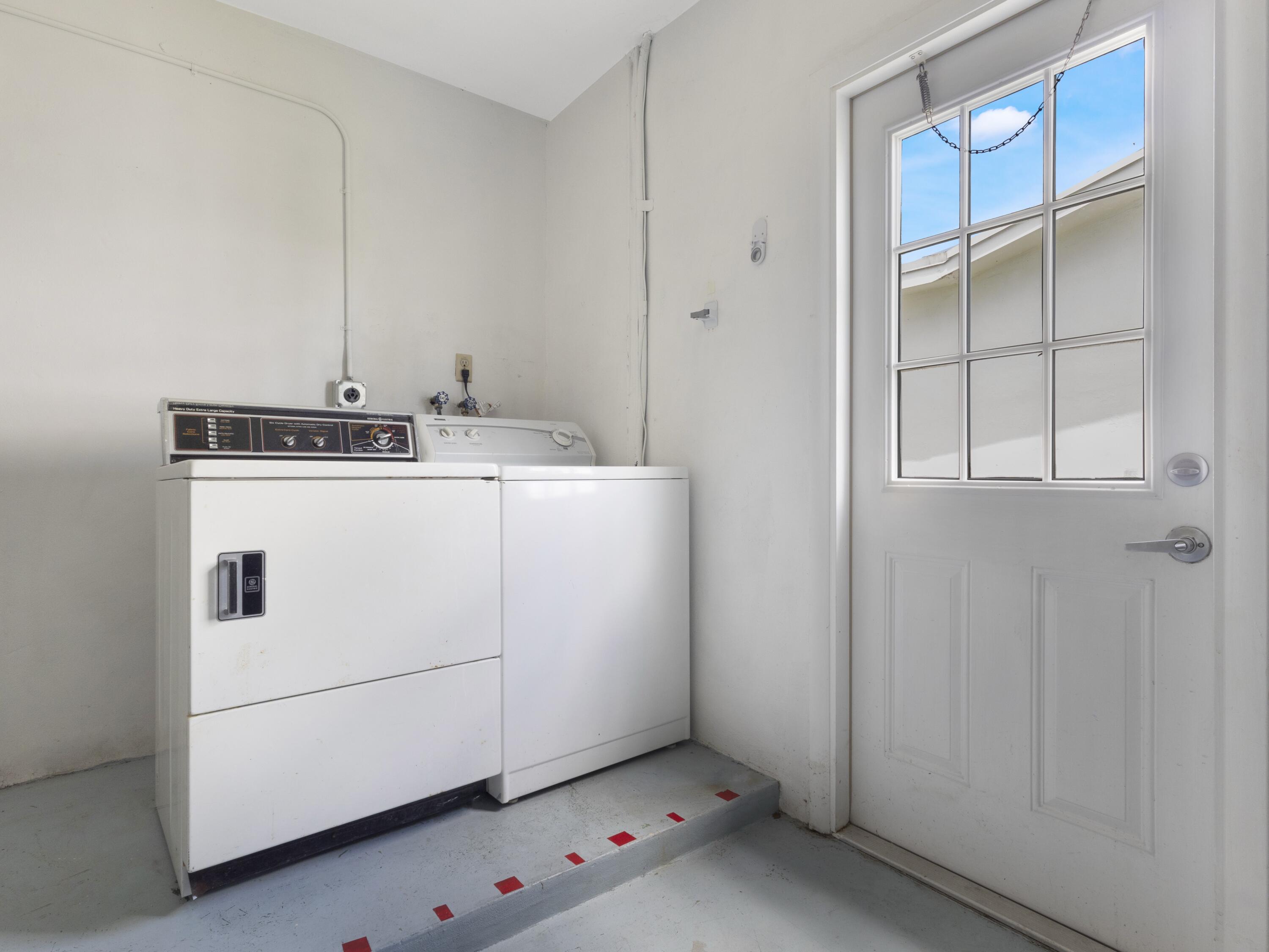 127 Leisureville Boulevard Boynton Beach, FL 33426 - Photo 16 of 23 a utility room with dryer and washer