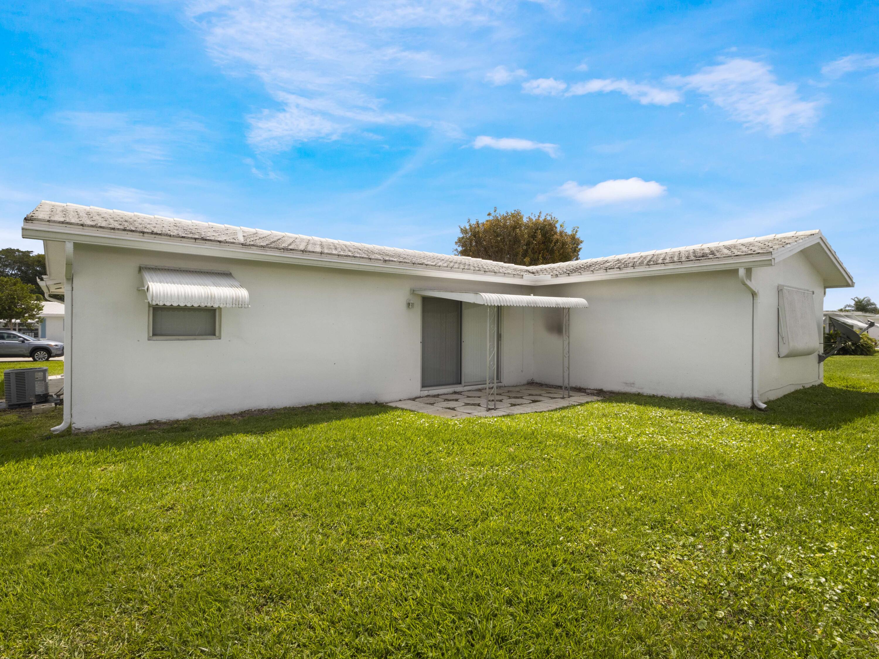 127 Leisureville Boulevard Boynton Beach, FL 33426 - Photo 17 of 23 a view of backyard with a garden